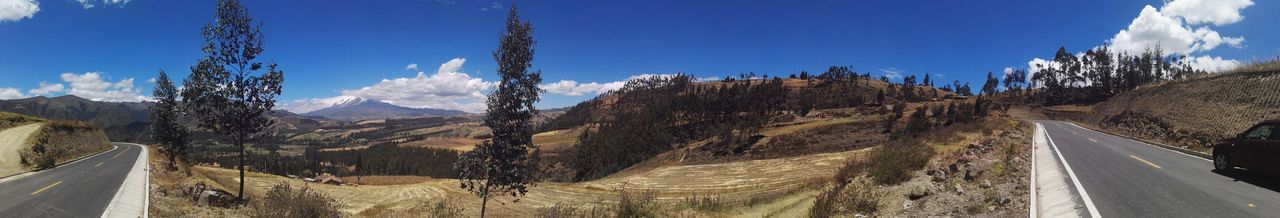 Panoramic view of road amidst mountains against sky