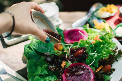 Close-up of hand holding vegetables