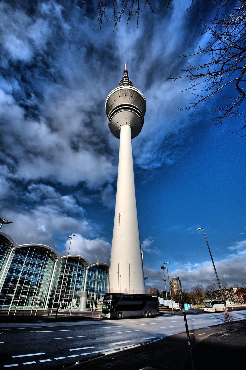 LOW ANGLE VIEW OF COMMUNICATIONS TOWER IN CITY