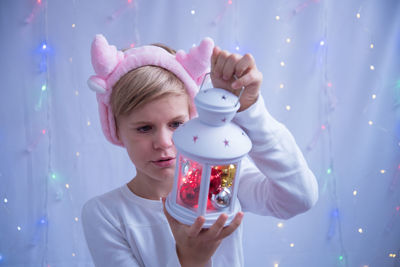 Portrait of boy holding camera