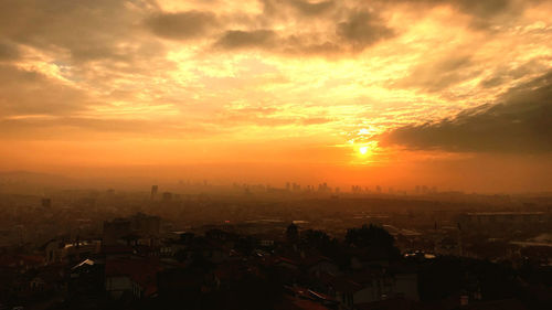 High angle view of townscape against sky during sunset