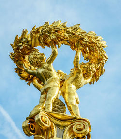 Low angle view of statue against sky