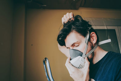 Close-up of man wearing gas mask