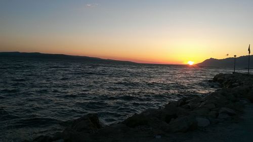 Scenic view of sea at sunset