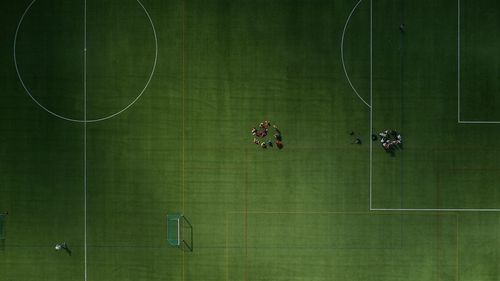 Directly above shot of people playing soccer on field