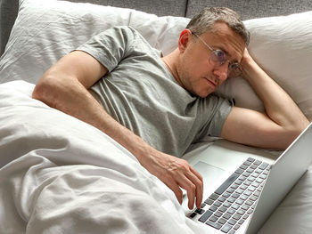 Young woman using laptop at home