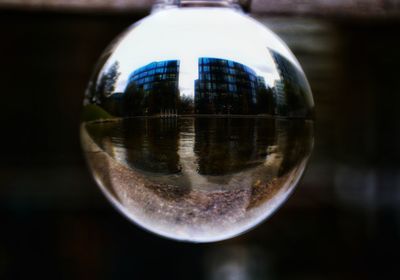 Close-up of crystal ball on metal