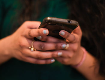 Close-up of woman using mobile phone
