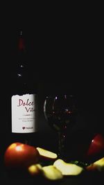 Close-up of wine glass against black background