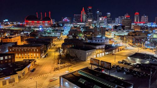 High angle view of illuminated buildings in city at night