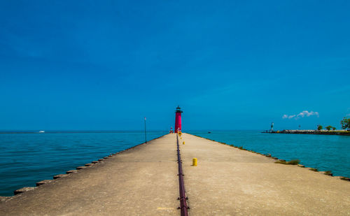 Scenic view of sea against blue sky