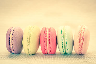 Close-up of multi colored candies against white background