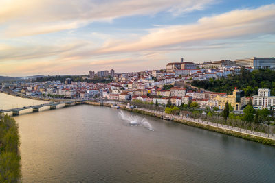 Coimbra city drone view with historic buildings at sunset, in portugal