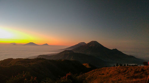 Scenic view of mountains against sky during sunset