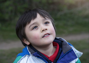 Close-up of cute thoughtful boy