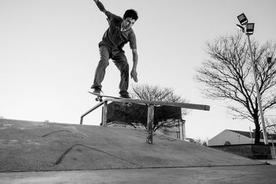 Skateboarder sliding down a ramp