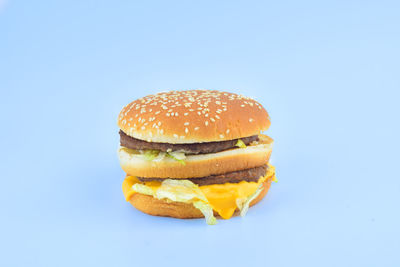 Close-up of burger against blue background