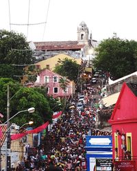 Crowd on city against clear sky