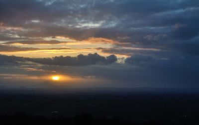 Scenic view of dramatic sky during sunset
