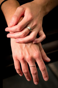 Close-up of couple holding hands