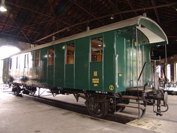 Train on railroad station platform at night