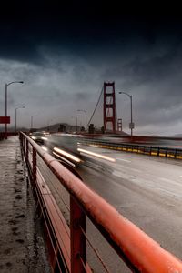 Light trails on road against sky at night