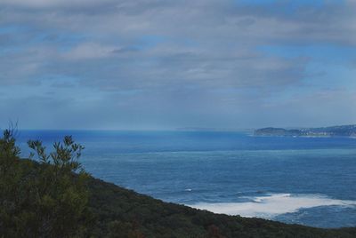 Scenic view of sea against blue sky