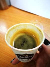 Close-up of coffee cup on table