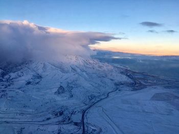 Scenic view of snow mountains against sky