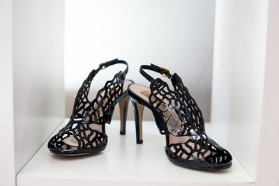 Close-up of shoes on table at home