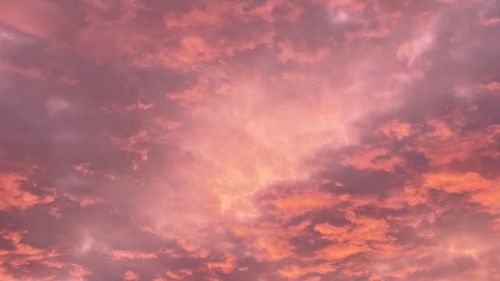 Low angle view of dramatic sky during sunset