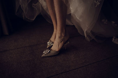 Low section of woman standing on floor