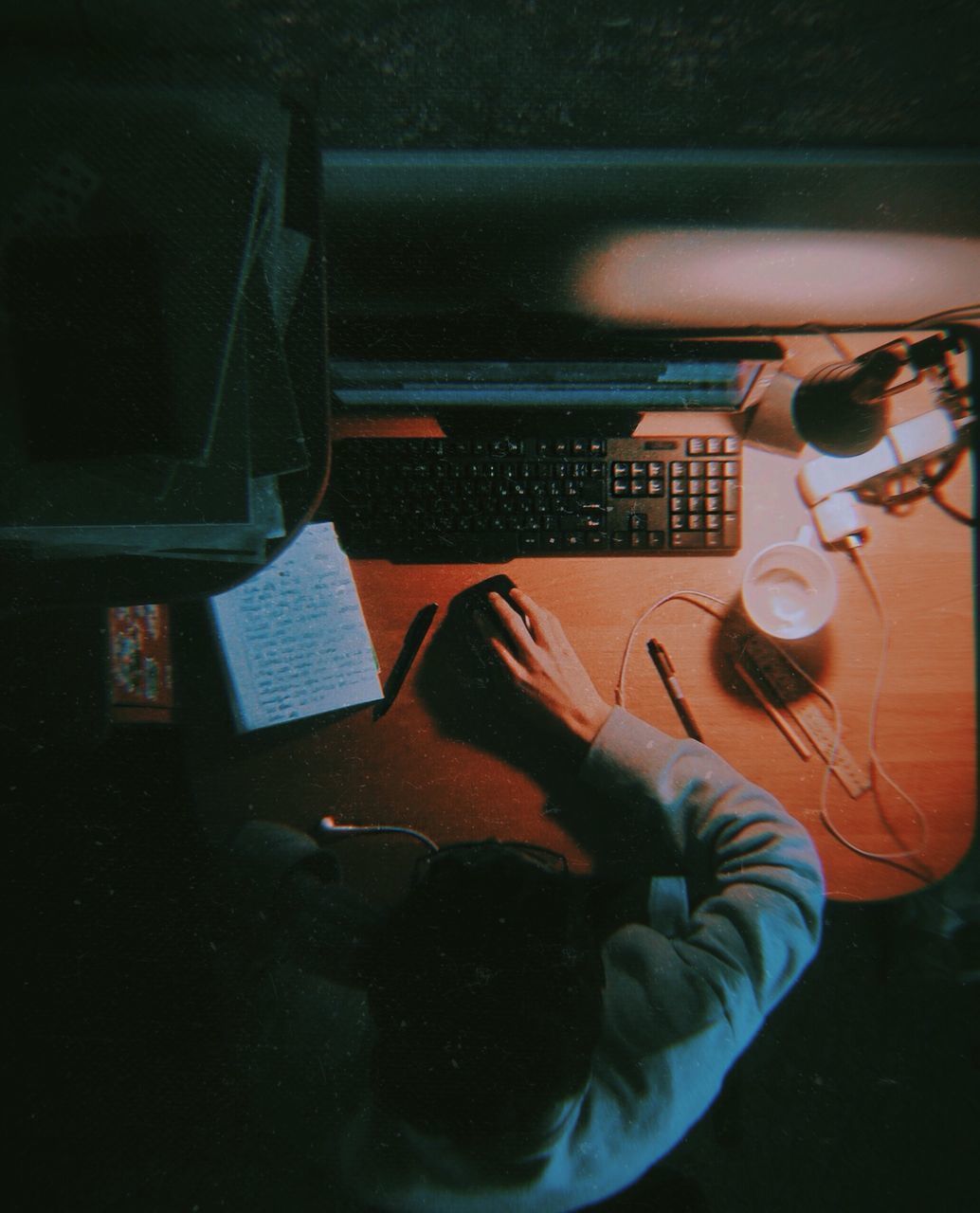 CLOSE-UP OF WOMAN USING MOBILE PHONE IN KITCHEN