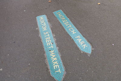 High angle view of text on road