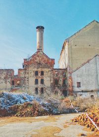 Abandoned factory against sky