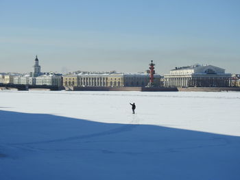 View of buildings on snow covered landscape