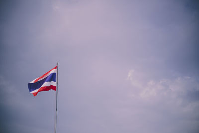 Low angle view of flag against sky