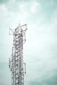 Low angle view of crane against sky