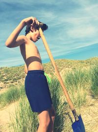 Woman standing on grass