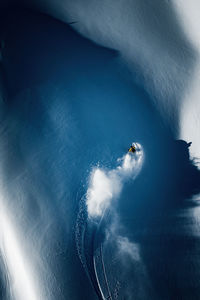 Aerial photo of adult man backcountry powder skiing in the kootenays, b.c., canada