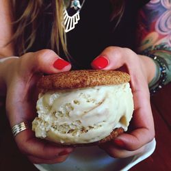 Midsection of woman holding ice cream