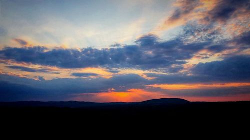 Scenic view of dramatic sky during sunset