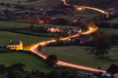 High angle view of light trails on road at night