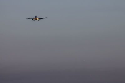 Low angle view of airplane flying in sky