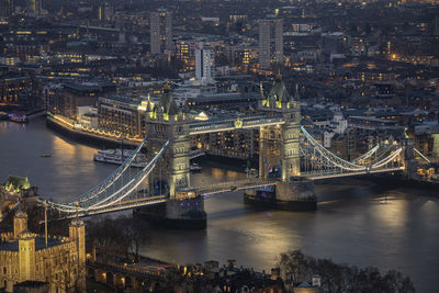 High angle view of illuminated bridge over river at night