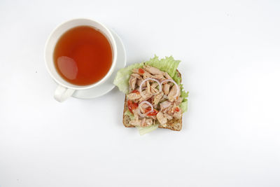 High angle view of tea on table against white background