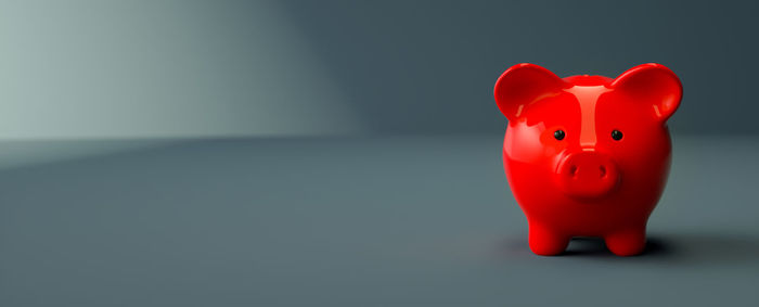 Close-up of red toy against gray background