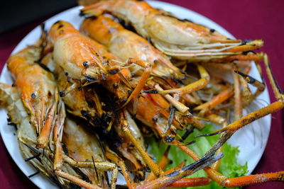 Grilled shrimp in a thai restaurant , high angle view of seafood in plate
