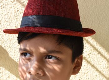 Close-up portrait of boy wearing hat