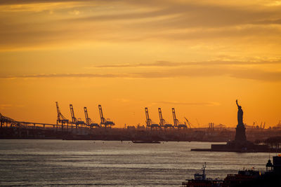 The statue of liberty at sunset in new york, nyc